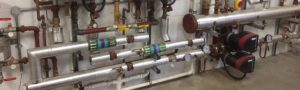 Sound Heating Commercial Boiler Servicing - Plant Room Pipe Work and Pump Photo